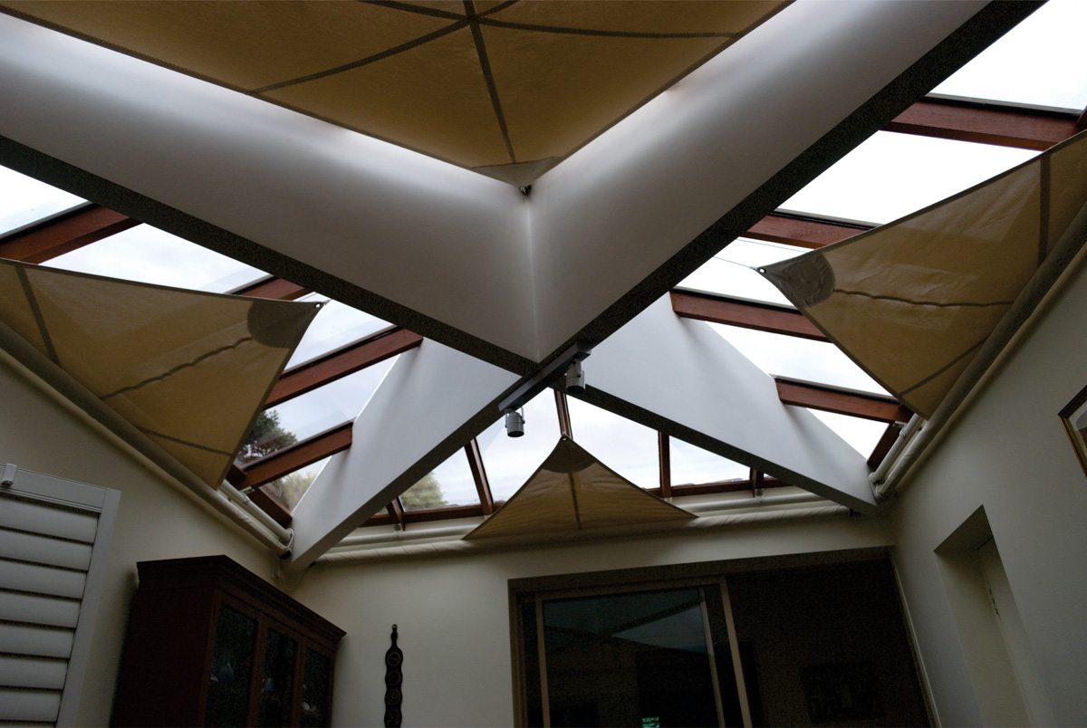 retracting awnings for glass roof