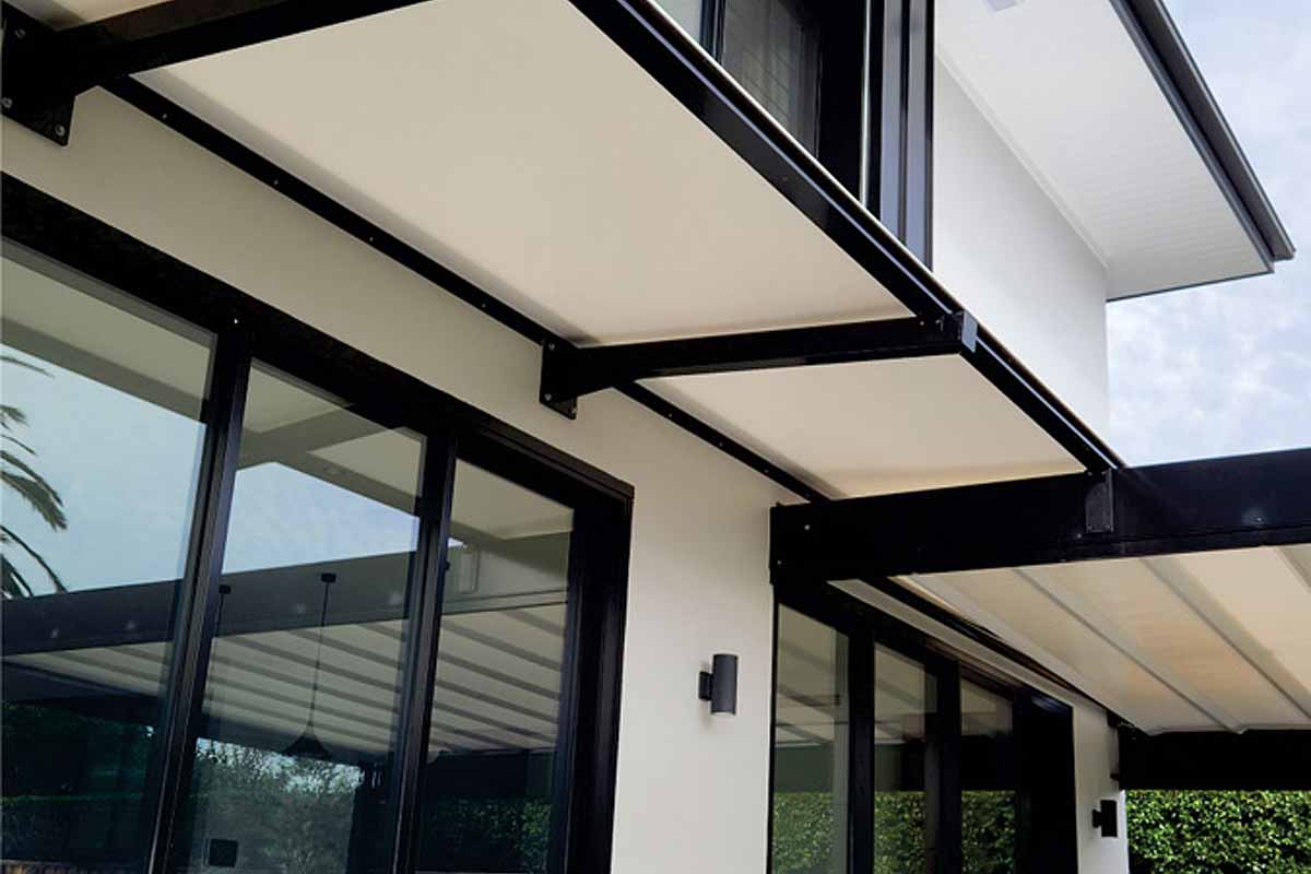 wall mounted cantilevered awnings