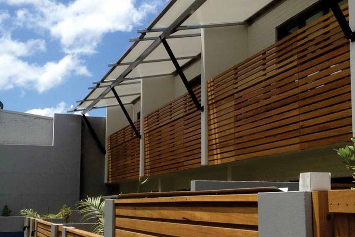 wall mounted cantilevered awnings